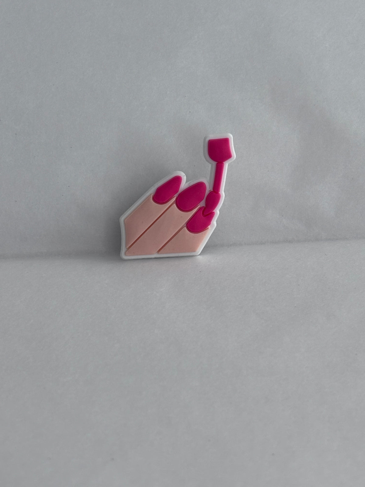 Pink painted nail varnish charm