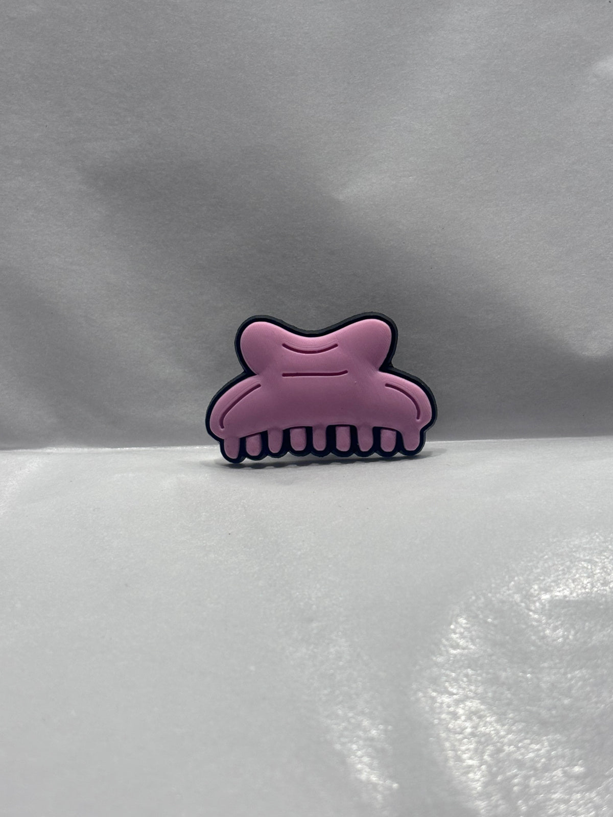 Comb charm