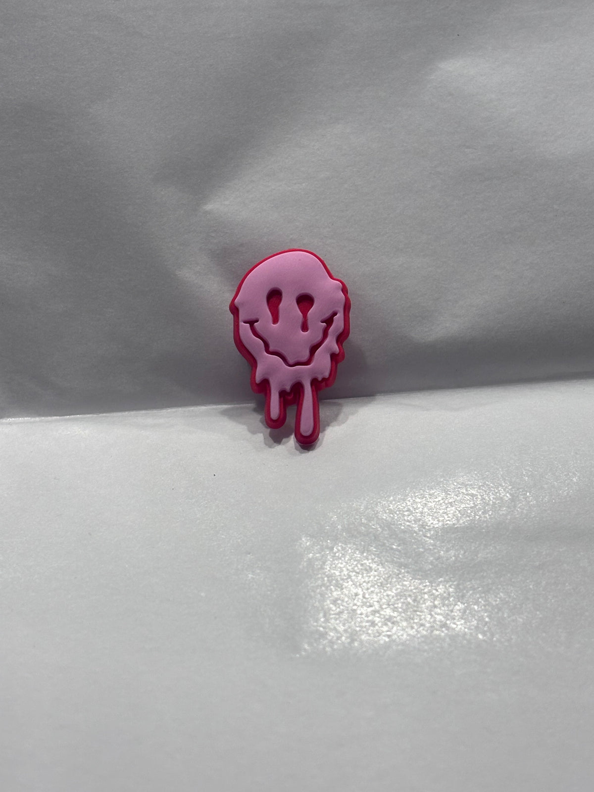 Drip face charm